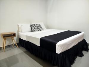 Postel nebo postele na pokoji v ubytování Citi Serviced Apartments - Gaba Place
