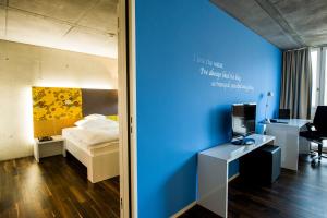 Ένα ή περισσότερα κρεβάτια σε δωμάτιο στο HOTEL APART - Welcoming l Urban Feel l Design