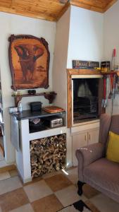 a living room with a fireplace and a tv at Amarachi Guesthouse in Swakopmund