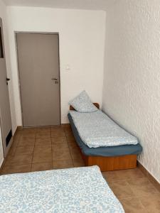 Postel nebo postele na pokoji v ubytování Pensjonat Lemon