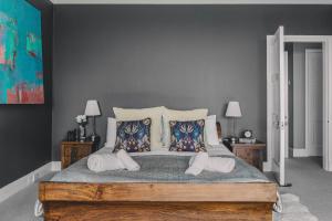 a bedroom with a large bed with two pillows at Little Redlap - Delightful views near Dartmouth in Dartmouth
