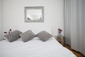 Postel nebo postele na pokoji v ubytování Tinel Superior Residence