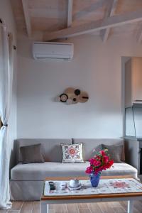a living room with a couch and a table at Coastal Haven Your Oasis by the Sea in Análipsis