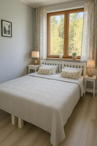 Postel nebo postele na pokoji v ubytování Pokoje Gościnne Pod Lasem + 18 fotografií