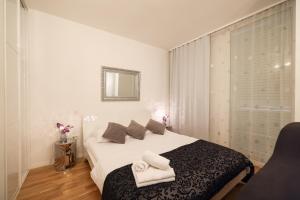 Postel nebo postele na pokoji v ubytování Tinel Superior Residence