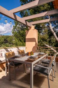 a dining table and chairs on a patio at Moraira Ritual de Terra By Elconserje in Moraira