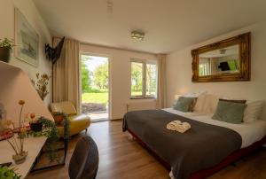 Postel nebo postele na pokoji v ubytování Hotel & Restaurant Weidumerhout