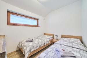 Posteľ alebo postele v izbe v ubytovaní Chalupa na Lipně - Holiday House 1