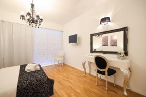 TV a/nebo společenská místnost v ubytování Tinel Superior Residence