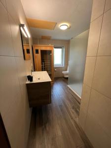 a bathroom with a sink and a toilet at Eden in Bullange +30 photos