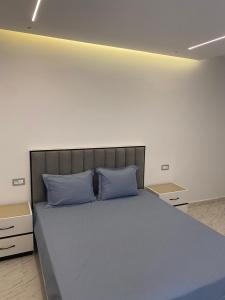 Postel nebo postele na pokoji v ubytování Duplex El mansoura A0