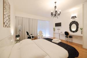 Postel nebo postele na pokoji v ubytování Tinel Superior Residence