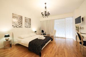 Postel nebo postele na pokoji v ubytování Tinel Superior Residence