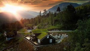 a house with a grass roof on a mountain at Skyline Lodge in Stryn +22 photos