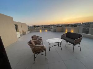 Balkón nebo terasa v ubytování The Rooftop Retreat