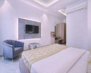 Postel nebo postele na pokoji v ubytování Hotel Star Suites By Star Group
