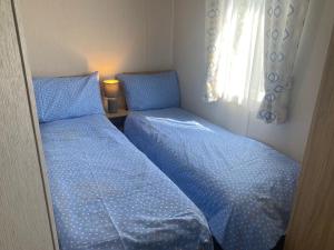 Ένα ή περισσότερα κρεβάτια σε δωμάτιο στο Family Friendly - 8 Berth - Skipsea Sands