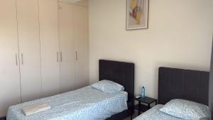 Ένα ή περισσότερα κρεβάτια σε δωμάτιο στο Unique City Center Rooms, 150m from Chabad Lubavitch