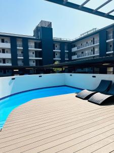 a swimming pool on the roof of a building at Next to Brooklyn Mall Cosy stay in Pretoria