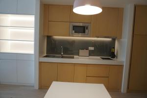 Kuchyň nebo kuchyňský kout v ubytování Zhengzhou Jianye Tianzhu International Apartment