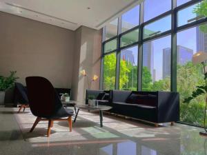 Posezení v ubytování Zhengzhou Jianye Tianzhu International Apartment