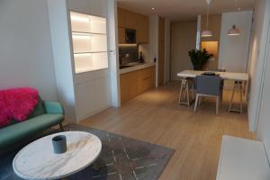 Kuchyň nebo kuchyňský kout v ubytování Zhengzhou Jianye Tianzhu International Apartment