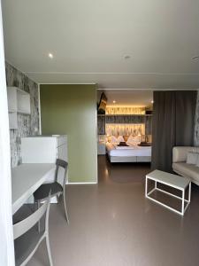 a living room with a couch and a table at Agriturismo Le Tese in Colà di Lazise +119 photos