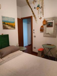 Postel nebo postele na pokoji v ubytování Vistazzurra B&B