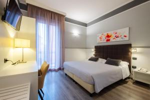 Postel nebo postele na pokoji v ubytování Hotel Italia