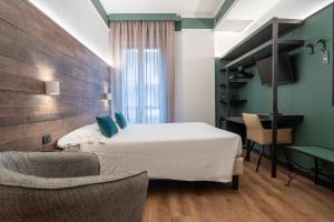 Postel nebo postele na pokoji v ubytování Hotel Italia