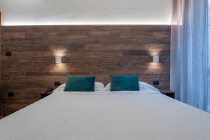 Postel nebo postele na pokoji v ubytování Hotel Italia