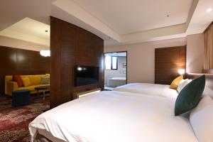 Rúm í herbergi á Via Hotel Breeze