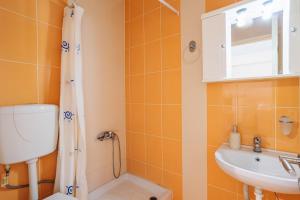 a bathroom with a shower and a toilet and a sink at Filiatra Cozy Cental Retreats with Balconies in Filiatra +35 photos