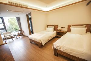 Postelja oz. postelje v sobi nastanitve Shanghai Liudi Mingshe Boutique Bed and Breakfast