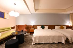 Rúm í herbergi á Via Hotel Breeze