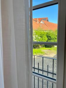 a window with a view of a roof at Gartenvilla in Marktheidenfeld
