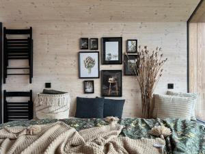 a room with a couch and pictures on the wall at Rosimi Domeček in Valtrovice