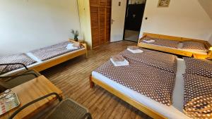 Ein Bett oder Betten in einem Zimmer der Unterkunft Baurů Dvůr