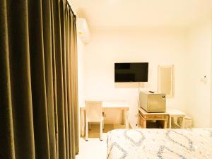TV a/nebo společenská místnost v ubytování Alita Hotel Sanur