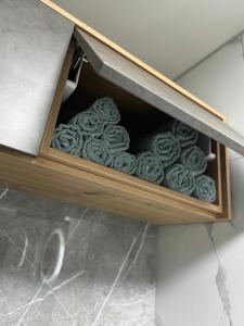 a drawer filled with cookies in a cabinet at MK Apartments PP in Poprad