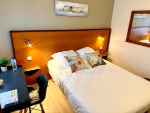 Postel nebo postele na pokoji v ubytování Hotel Capricorne