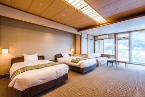 Una cama o camas en una habitación de Ooedo Onsen Monogatari Premium Ito Hotel New Okabe