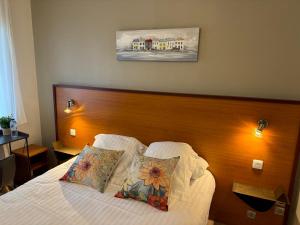 Postel nebo postele na pokoji v ubytování Hotel Capricorne