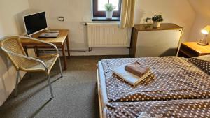 Ein Bett oder Betten in einem Zimmer der Unterkunft Baurů Dvůr