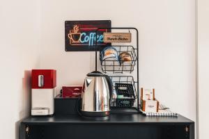 a coffee maker sitting on top of a table at Im Herzen von Bad Ischl #1 in Bad Ischl