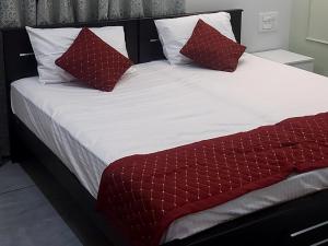 Postel nebo postele na pokoji v ubytování Olive Inn Apartment