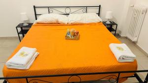 Postel nebo postele na pokoji v ubytování Fiordalisi home