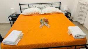 Postel nebo postele na pokoji v ubytování Fiordalisi home