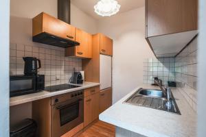 Køkken eller tekøkken på Zentral am Fluss #1