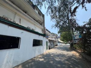 a white building on the side of a street at Subiza Beach Resort in Olongapo